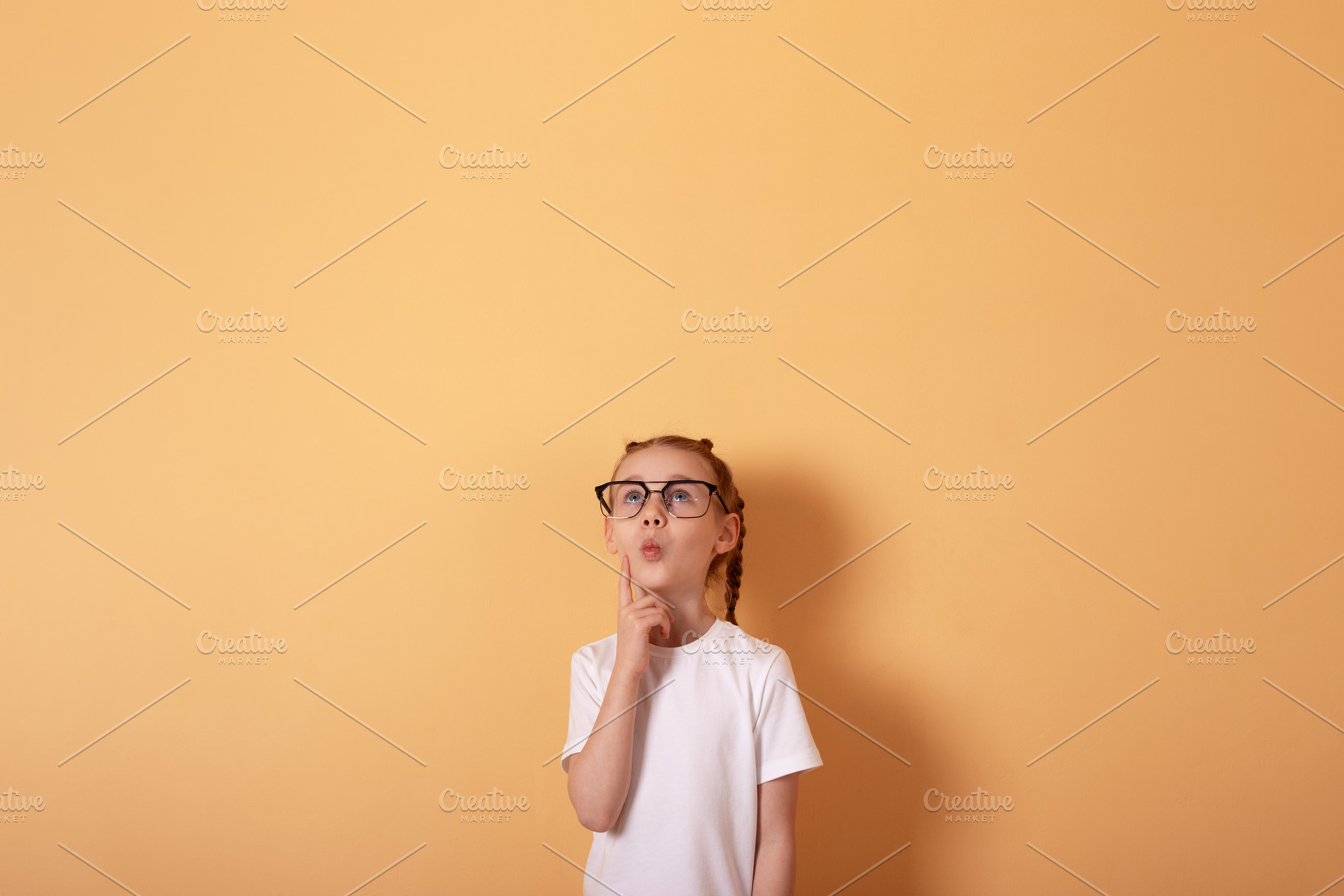 Young girl in glasses and white shirt thinking, standing against, a Person Photo by Ales Munt