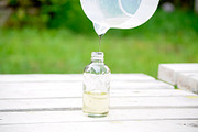 Pouring oil, a Health & Medical Photo by Friendly Design Co (Thumbnail 1 of 2)