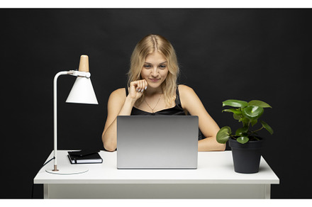 Cheerful business lady working on, a Person Photo by volodymyrshtun13795