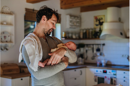 Close-up of father holding his, a Person Photo by HalfPoint