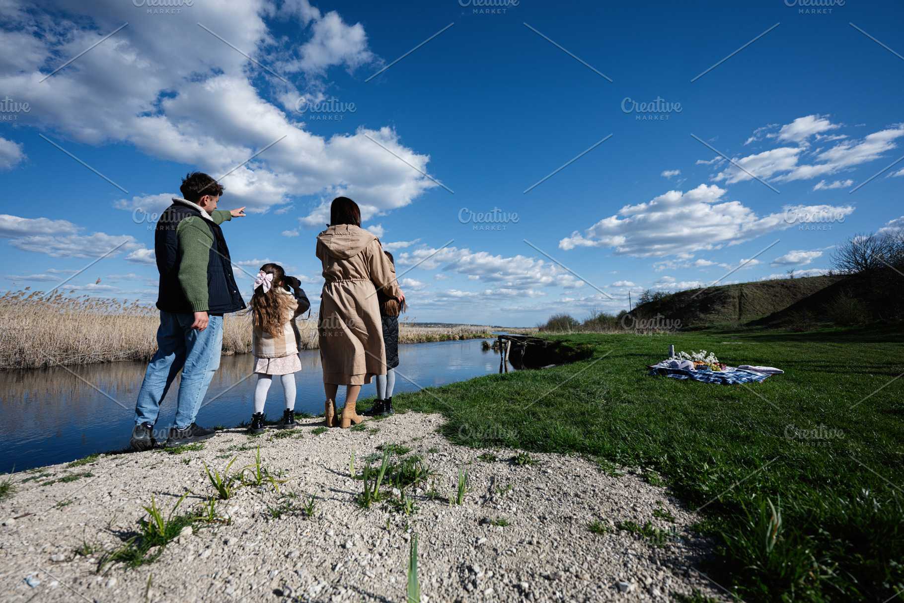 Family picnic by the river on a sunny spring day with parents and children enjo, a Person Photo by AS photostudio