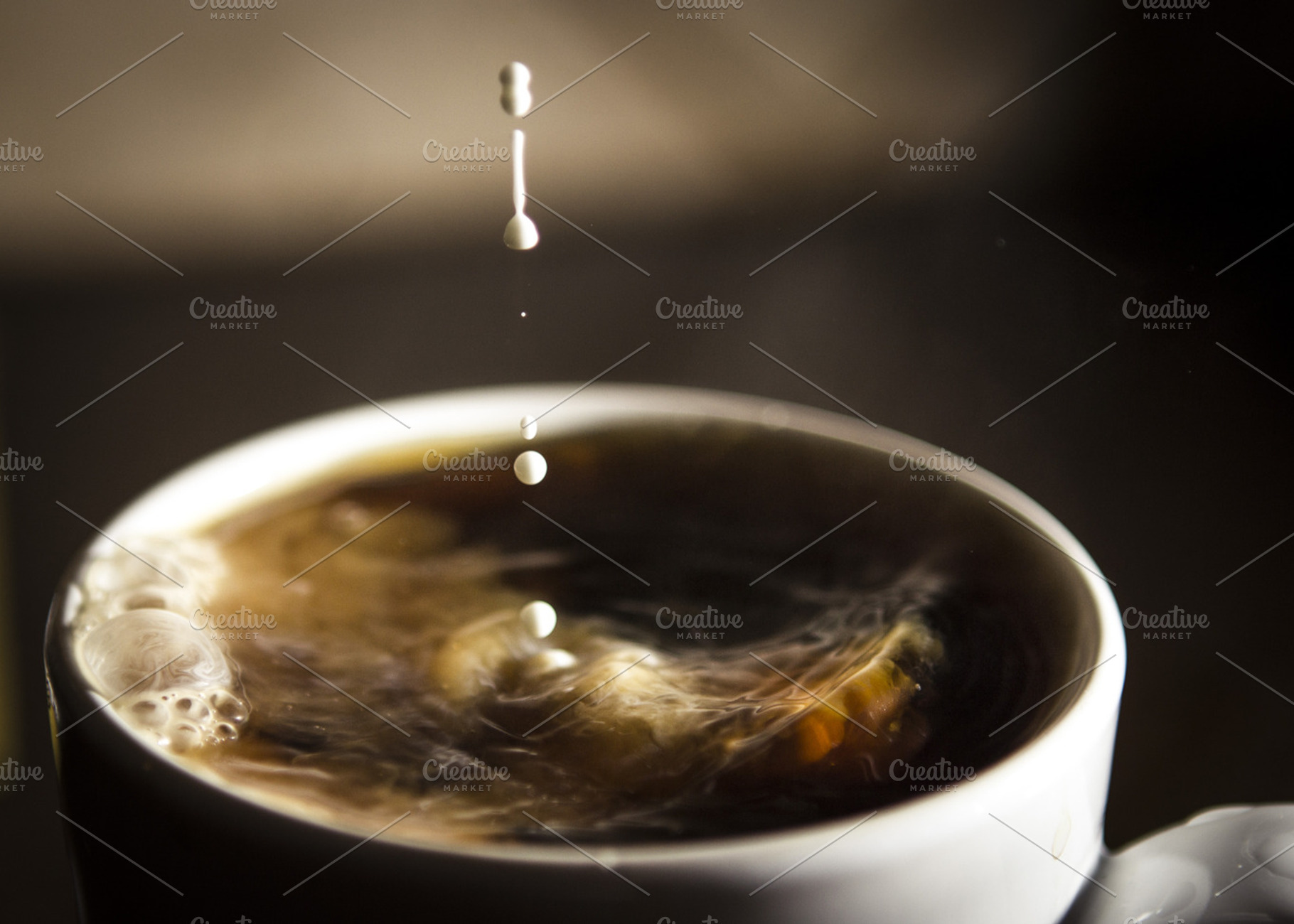 Cream poured into a cup of coffee