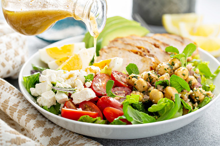 Healthy salad lunch bowl with chicken, avocado and chickpeas, a Food & Drink Photo by farwasser