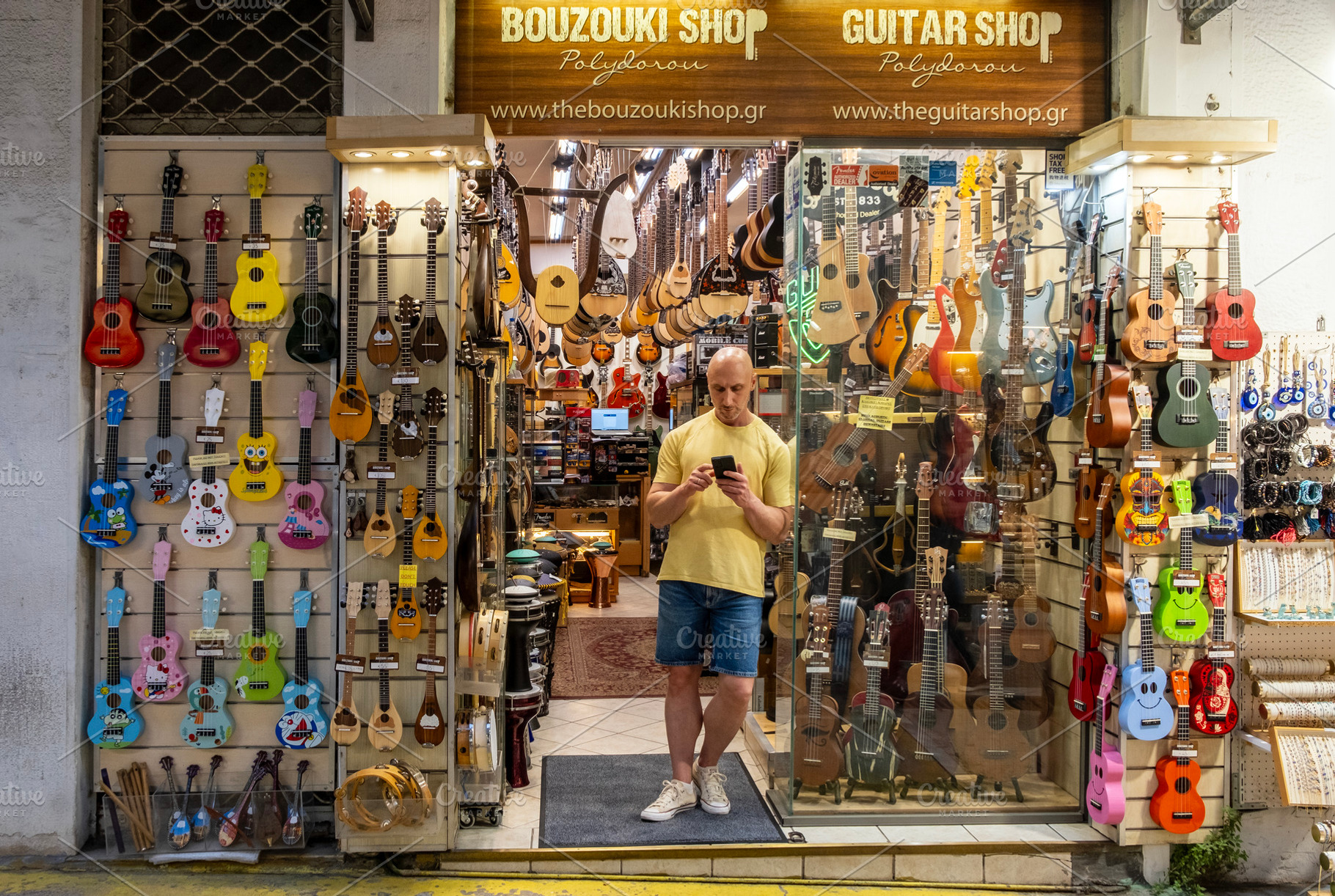 Guitar shop entrance and display, an Arts & Entertainment Photo by BOOCYS