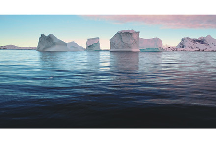 Many icebergs drifting ocean sunset