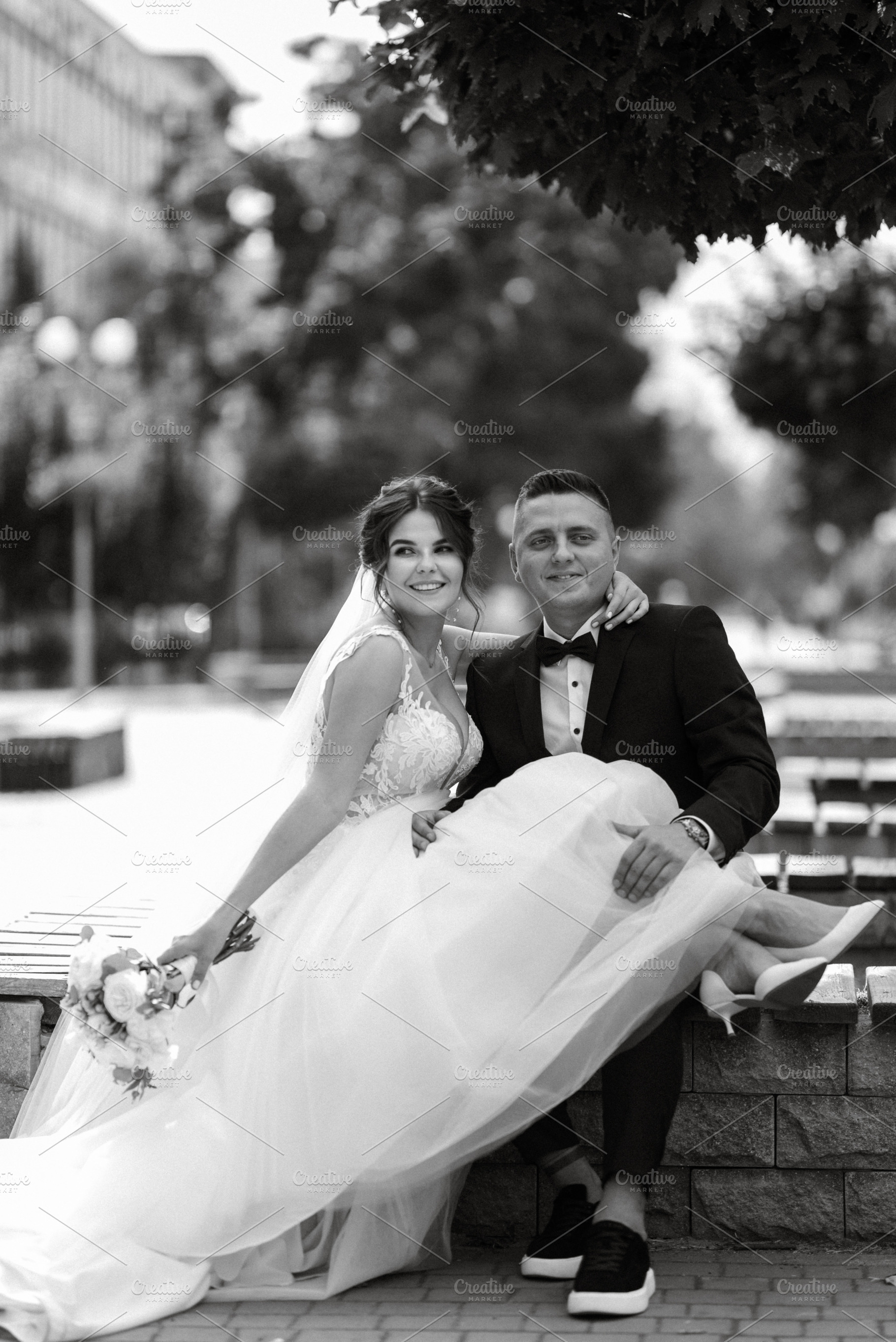 the groom in a brown suit and the bride in a white dress, a Person Photo by Weddings, People, Travel