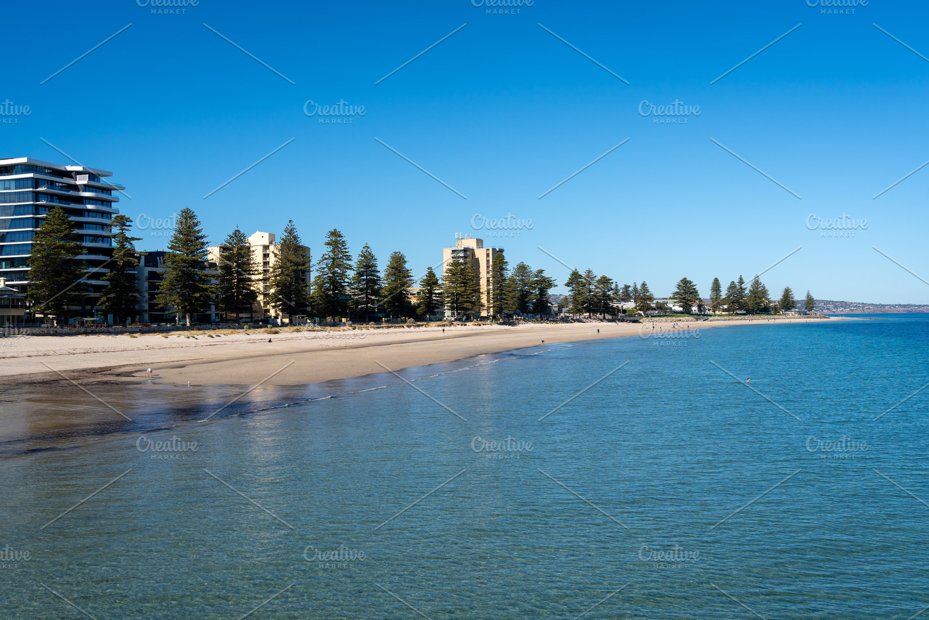 Golden sand and blue waters at Glenelg Beach, Adelaide, Australi, a Nature Photo by GoodGoods