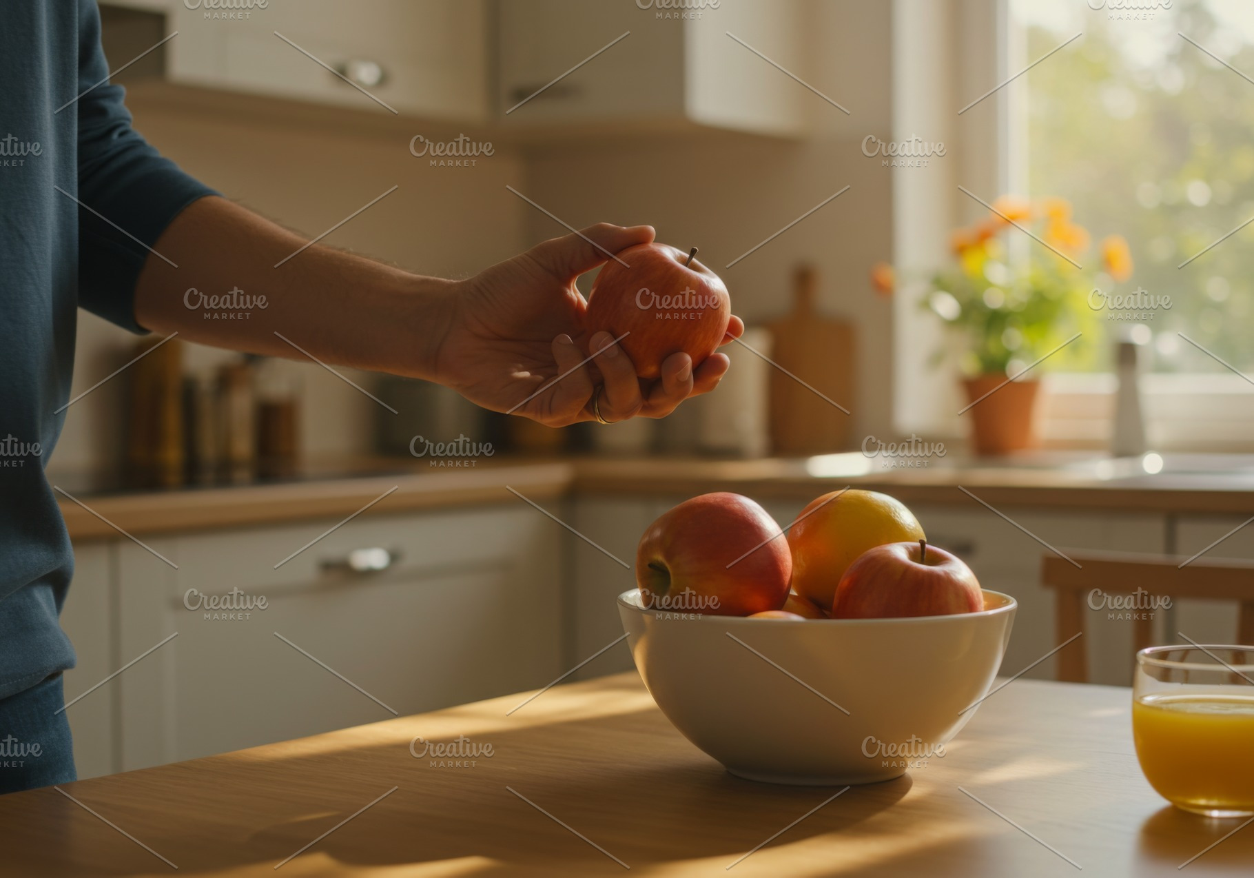 Person holding a fresh apple in a su, a Food & Drink Photo by professorinc