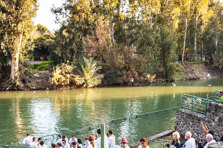 Christian pilgrims make  baptism, a Nature Photo by kavram