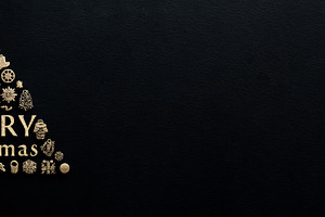 Gold Merry Christmas typography in shape of tree with festive ic, a Holiday Photo by José Manuel Gelpi