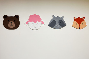 Cute animal faces wall decorations featuring bear, sheep, raccoon, and fox desi, a Photo by AS photostudio