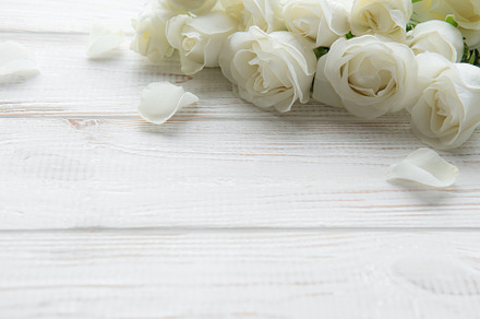 White roses on a wooden table, a Nature Photo by Olena Rudo
