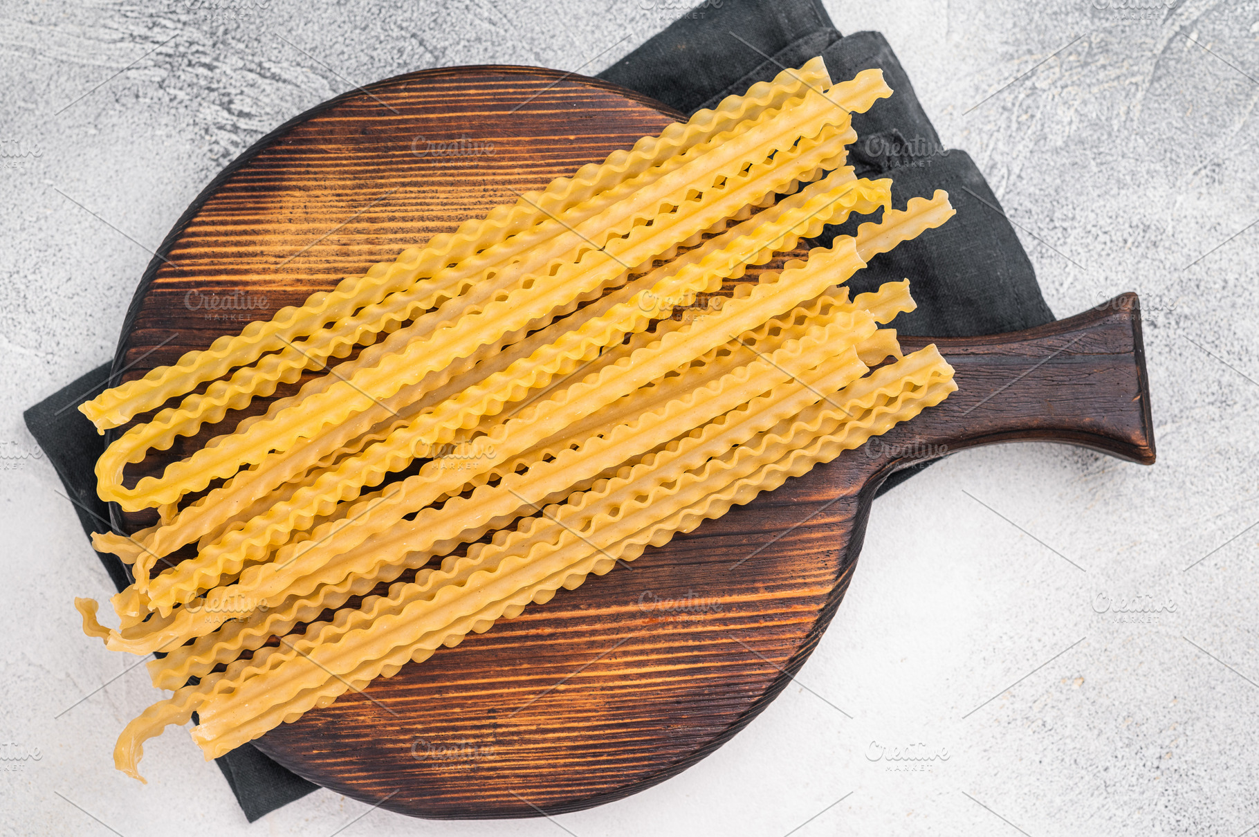 Delicate raw mafaldine pasta noodles, perfect for tossing with f, a Food & Drink Photo by composter-box@mail.ru