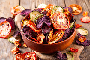 Healthy alternative for traditional potato chips, dry vegetables, a Food & Drink Photo by Rimma