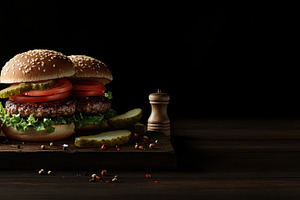Gourmet burger on wood board, a Photo by Beautiful things
