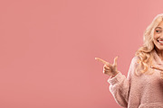 Excited young lady pointing and looking aside at empty space, demonstrating pla, a Photo by Prostock-Studio (Thumbnail 2 of 2)