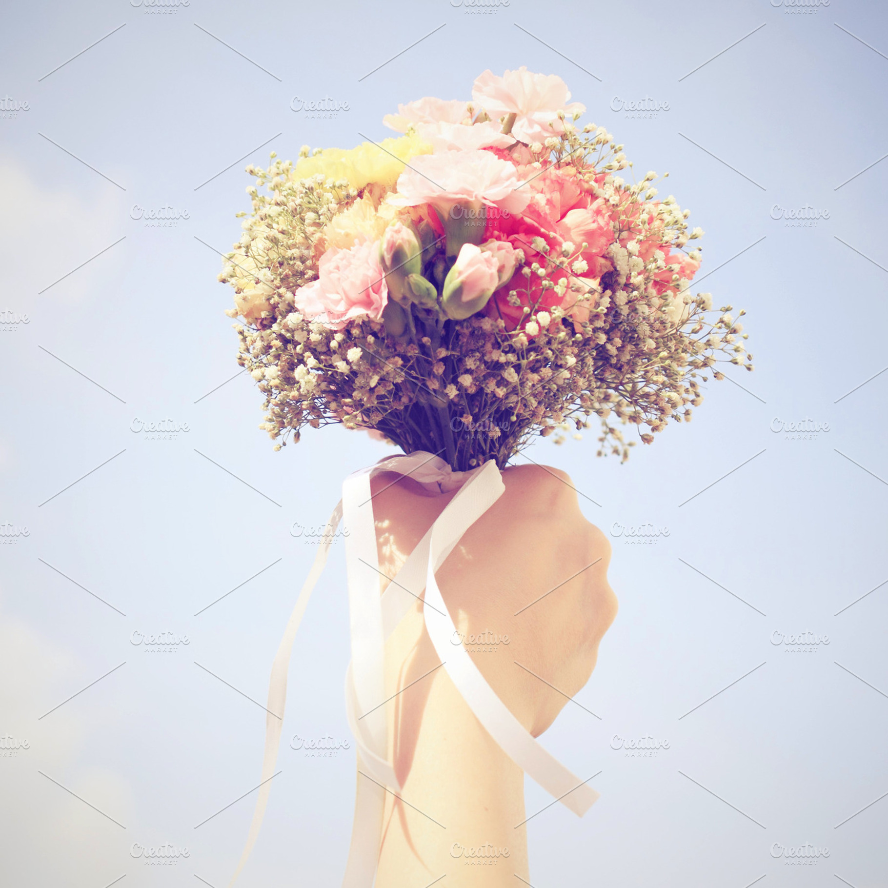 Bouquet of flower in hand containing hand, holding, and bouquet
