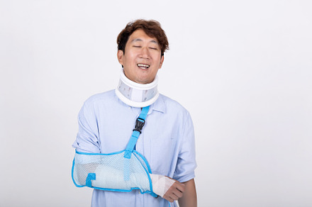 Asian man feeling relaxed eyes closed with broken arm and neck i