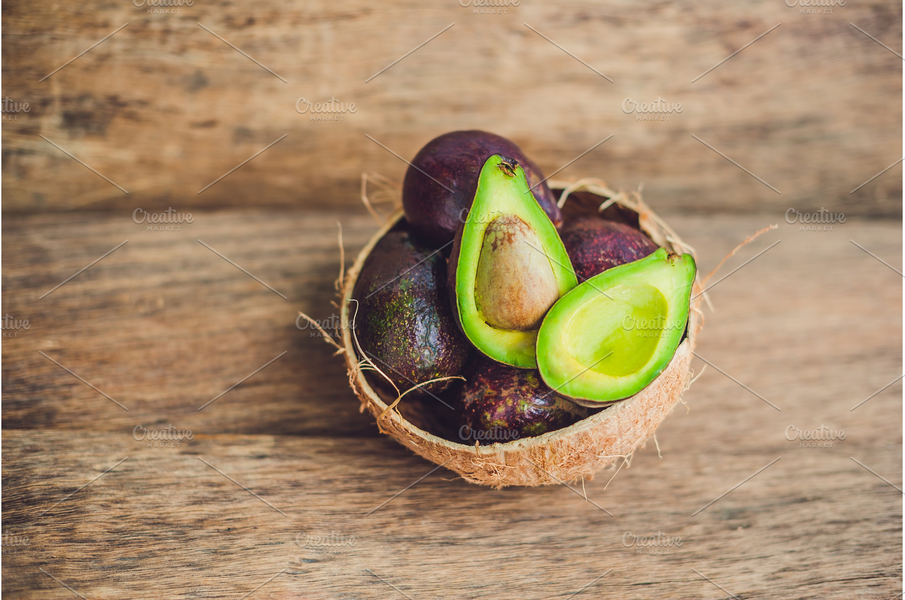 Fresh organic avocado on dark old, a Food & Drink Photo by Elizaveta Galitskaya