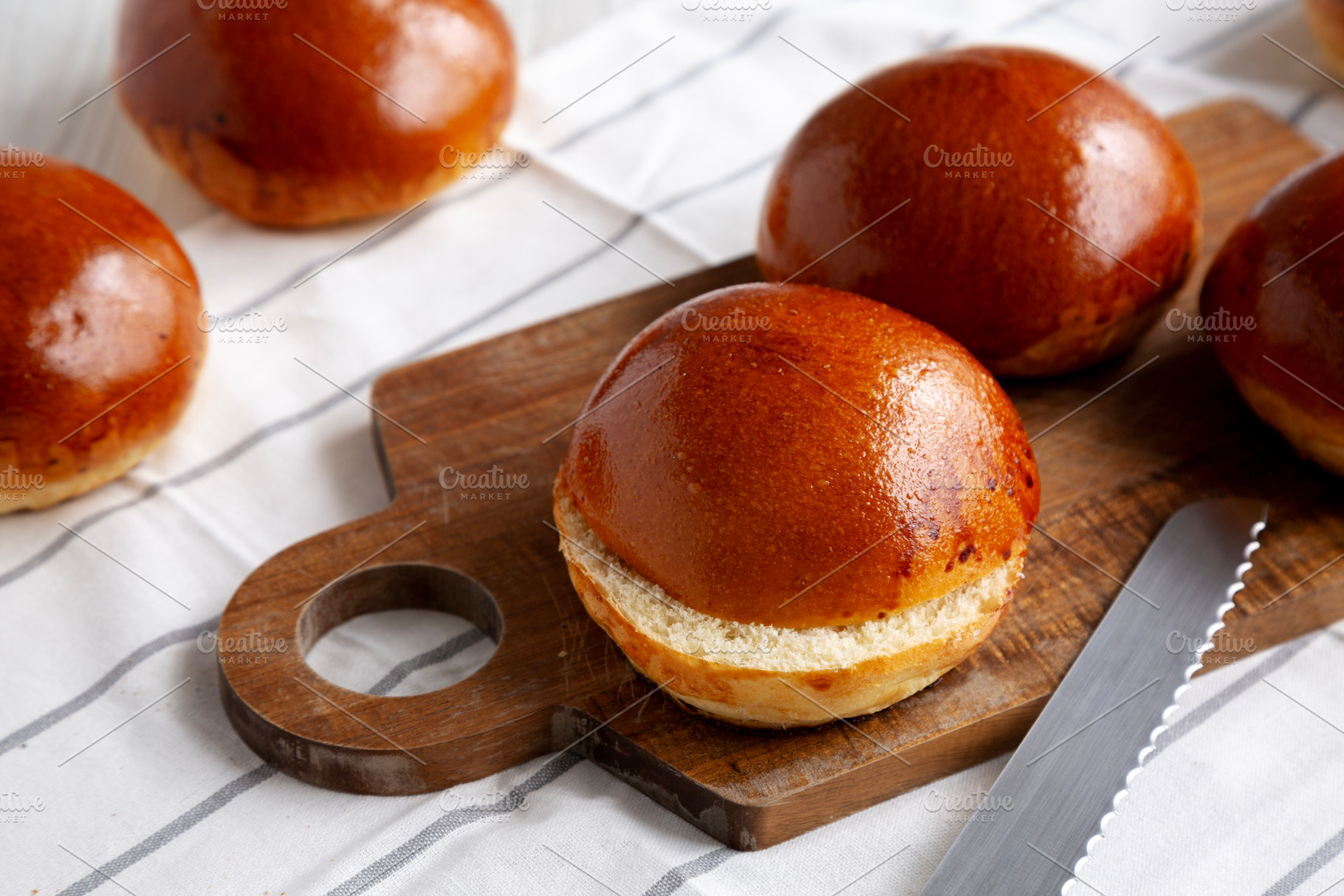 Homemade Brioche Buns Ready to Eat, side view., a Food & Drink Photo by LiudmylaChuhunova