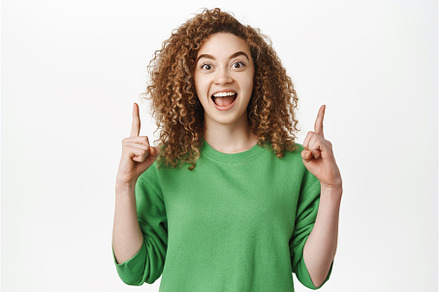 Hey take a look. Excited smiling, a Person Photo by Cookie Studio