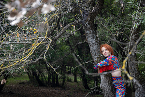 Dreamy woman with red hair looking u, a Person Photo by Imaginarium
