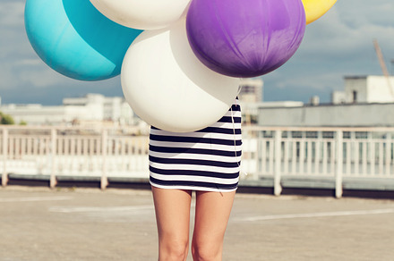Colorful latex balloons containing woman, young, and colorful, a Person Photo by Aliaksei Kaponia