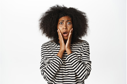 Shocked and concerned african woman, a Person Photo by Cookie Studio