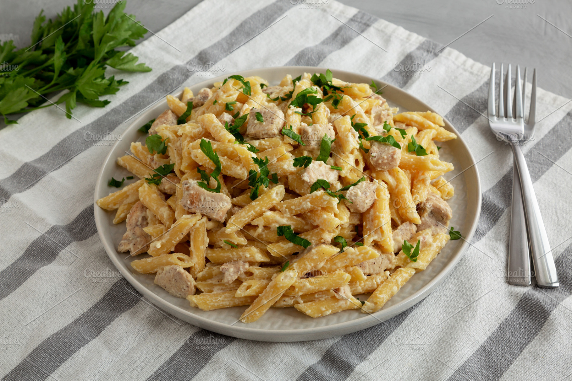 Homemade One-Pot Chicken Alfredo Pasta with Parsley, a Photo by LiudmylaChuhunova