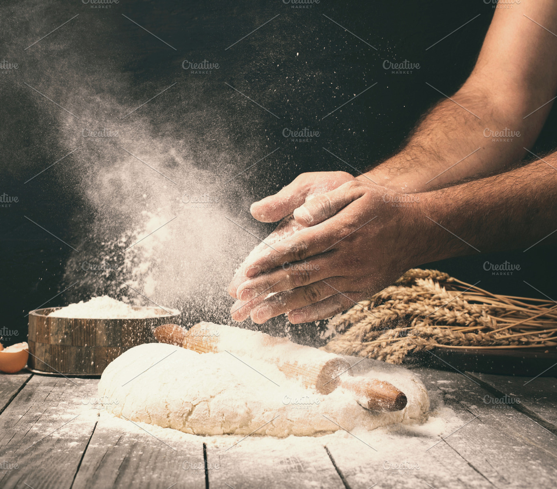 Man preparing bread dough, a Food & Drink Photo by KucherPhoto