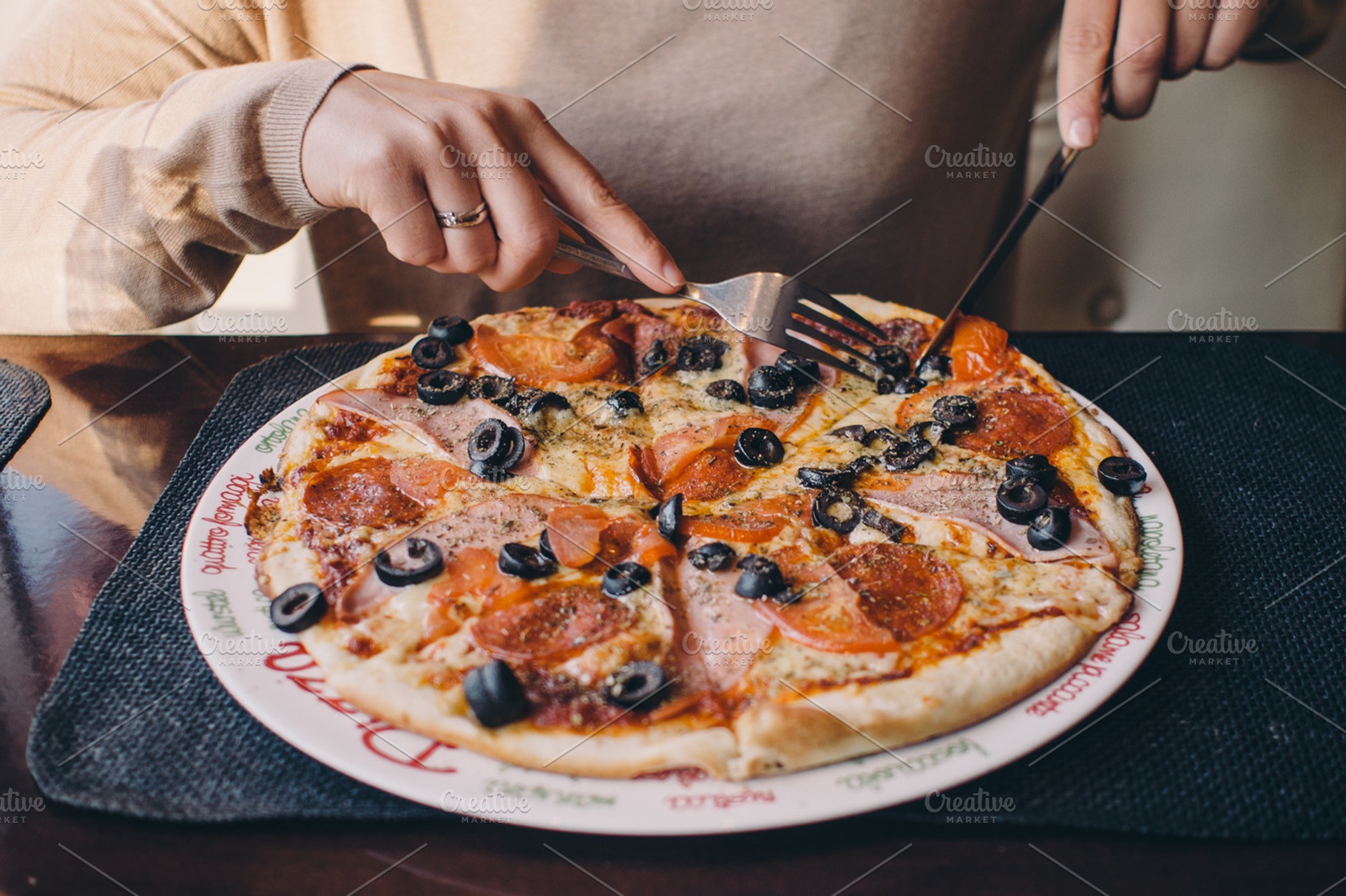Woman eating delicious pizza, a Food & Drink Photo by Pawel Kadysz
