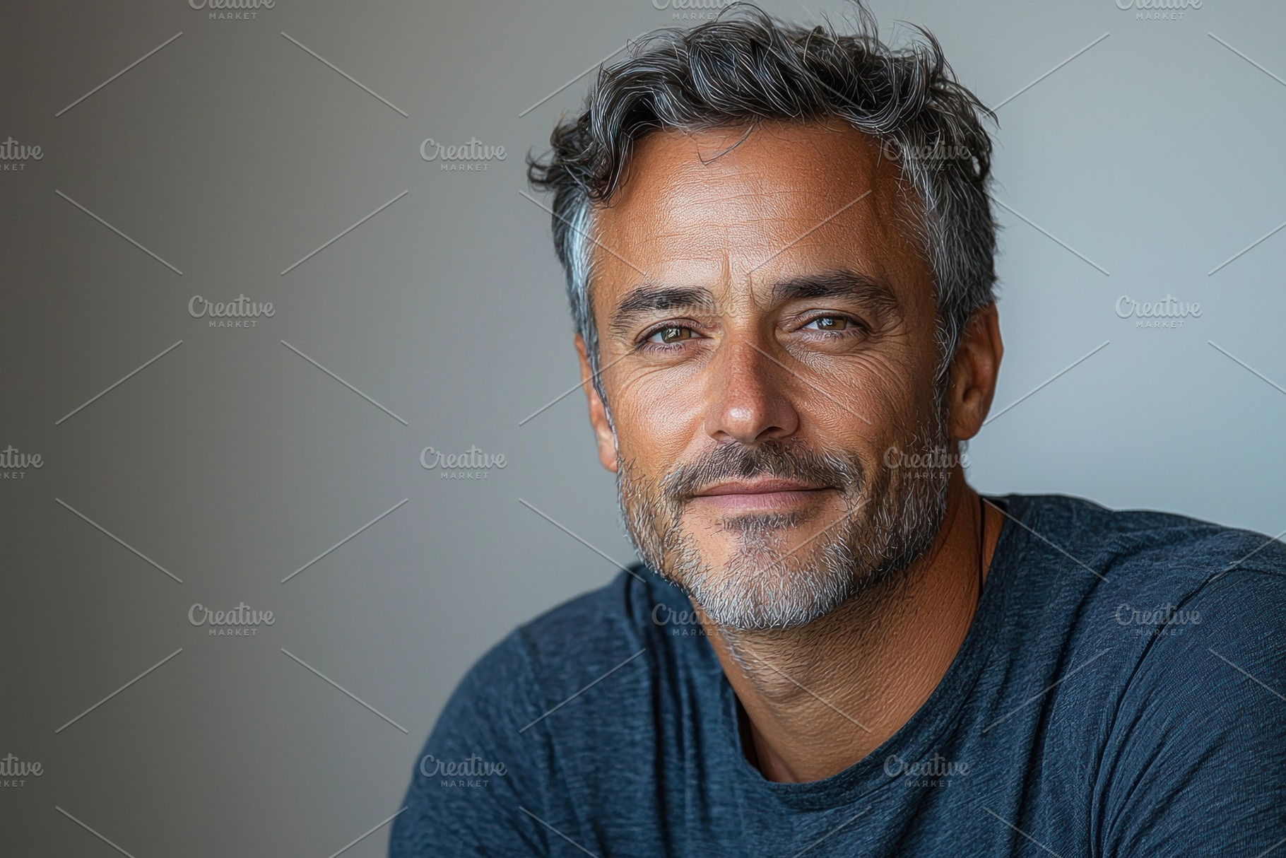 Confident mature man with salt and pepper hair wearing dark blue, a Person Photo by José Manuel Gelpi