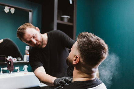 Professional beard grooming, rear view of male client of hairdre, a Person Photo by progressman