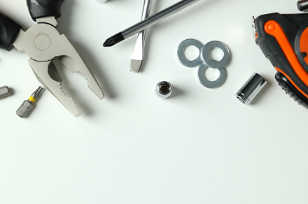 Work tools on white background, top view, an Industrial Photo by AtlasStudio PRO