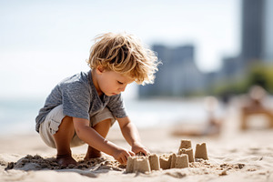 Blond boy playing on an urban beach, a Person Photo by MistyDay