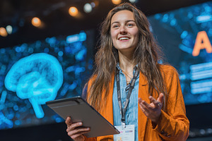 Woman Speaker Presenting AI Technolo, a Photo by Pixeness Studio