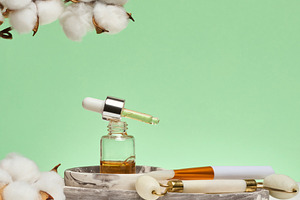 Dropper bottle with cosmetic oil, mask brush, jade facial massag, a Beauty & Fashion Photo by ndanko