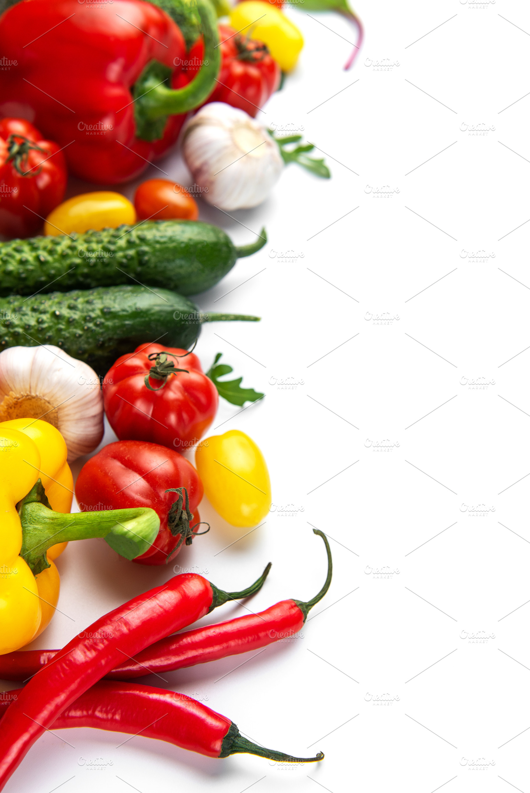 Fresh organic vegetables creating healthy vibrant food border, a Food & Drink Photo by Olena Rudo
