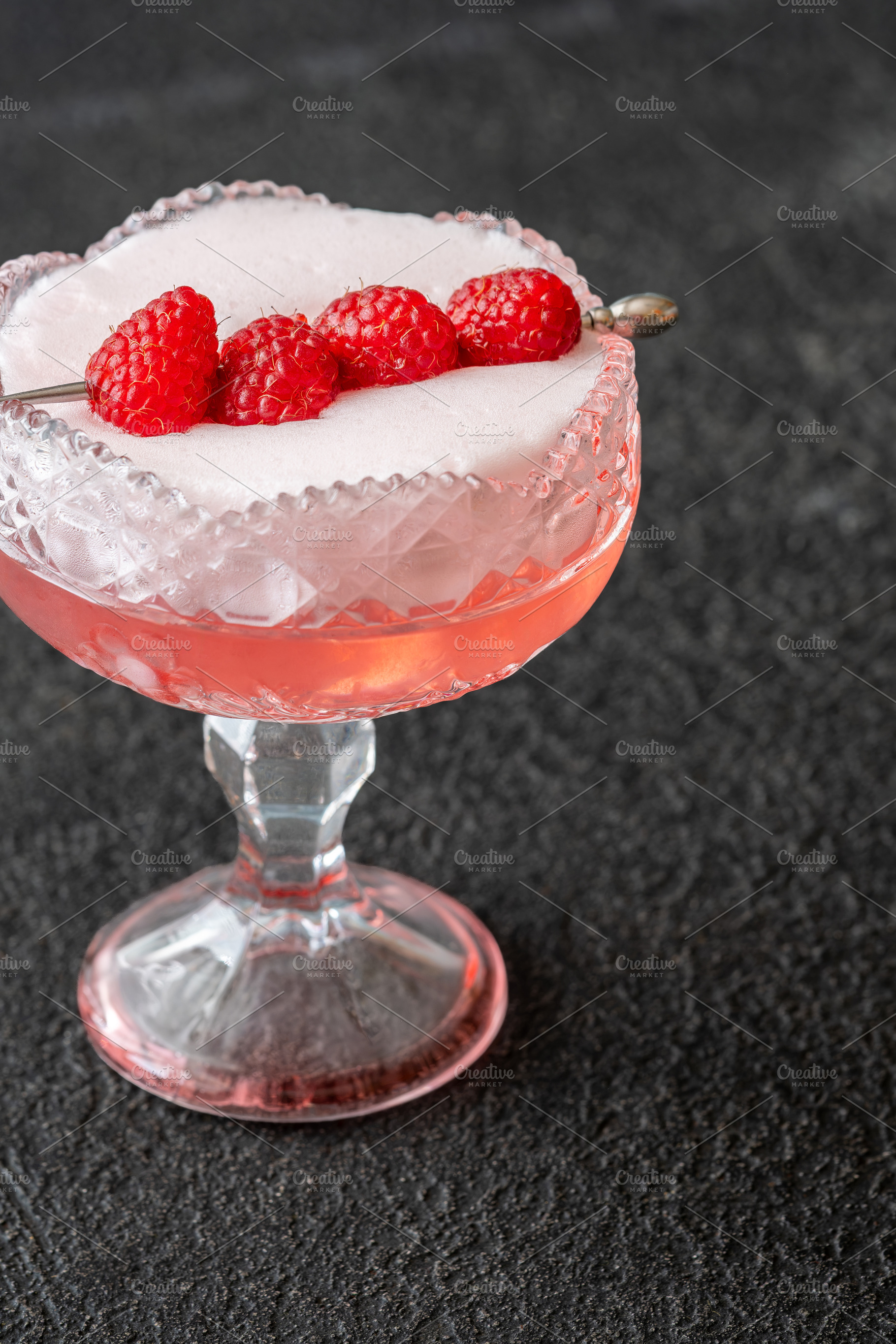 Elegant Clover Club cocktail with velvety foam fresh raspberries, a Food & Drink Photo by Alexander Prokopenko