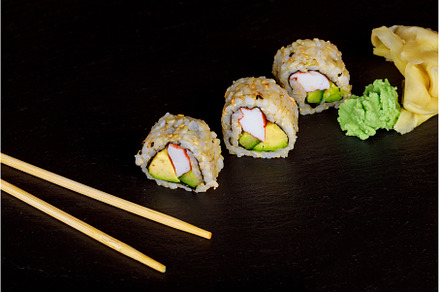 Sushi roll sushi with prawn, avocado, a Food & Drink Photo by Ungvar Studio