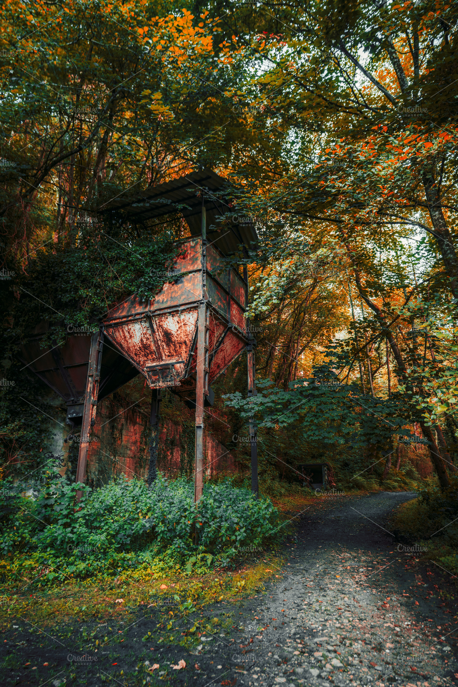 Rusty structure in autumn forest, an Industrial Photo by SkyNext