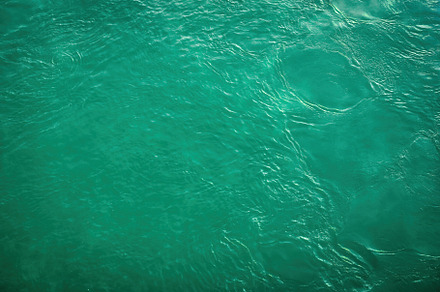 The texture of the waves of turquoise color of fast-flowing wate, a Nature Photo by Eugene_Photo