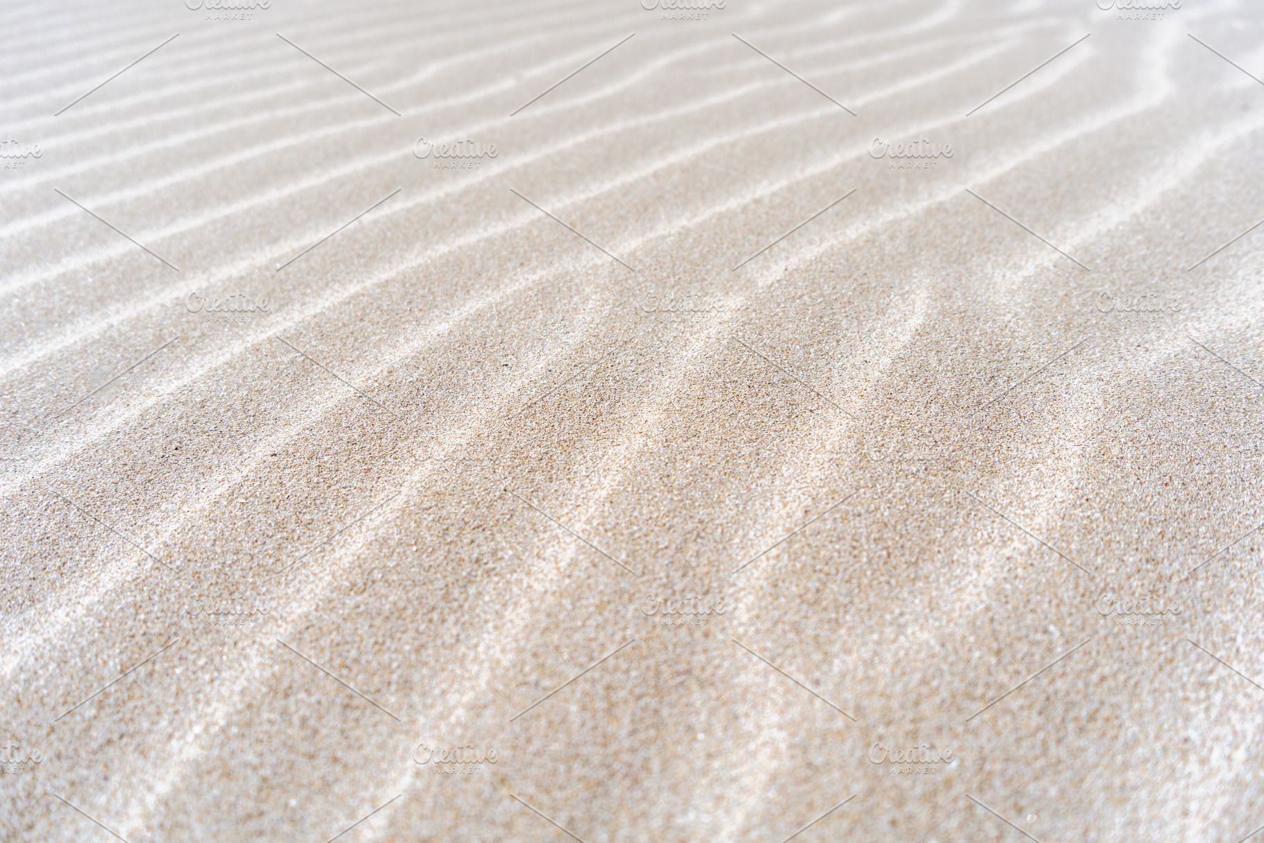 Close-up detail of natural patterns on sand dune surface, a Nature Photo by GoodGoods
