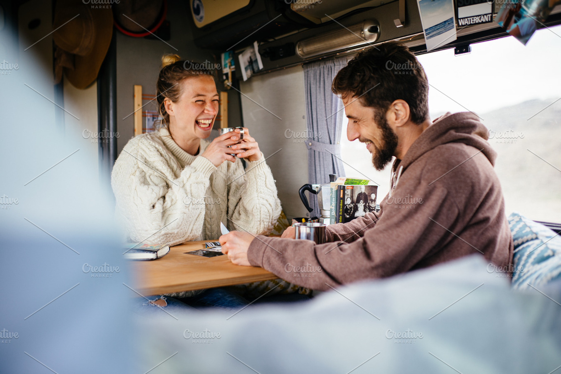 Two friends relaxing in camper van stock photo containing outdoor and sport, a Person Photo by Authentic Outdoor Photos