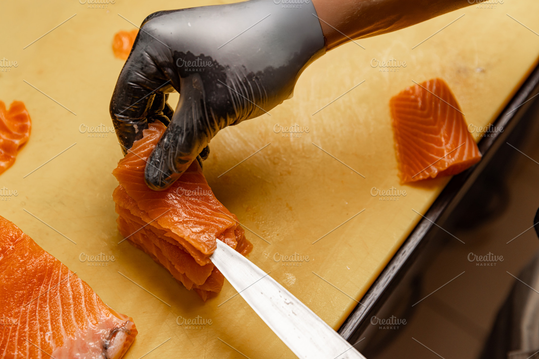 Chef arranging slices of fresh salmon, a Photo by Grafvision photography