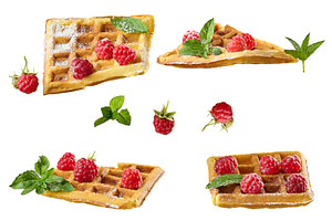 Belgian waffles with raspberries, mint and sprinkled with powder, a Food & Drink Photo by ndanko