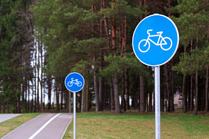 Bicycle path signs in a park, a Transportation Photo by BOOCYS
