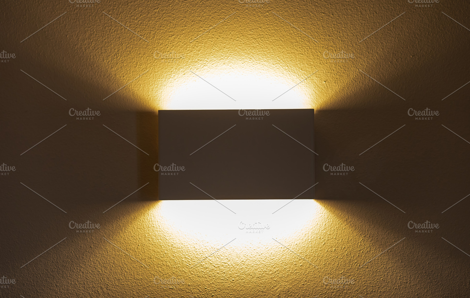Modern wall lamp illuminating textured wall with warm light, an Architecture Photo by Antonio Gravante Market