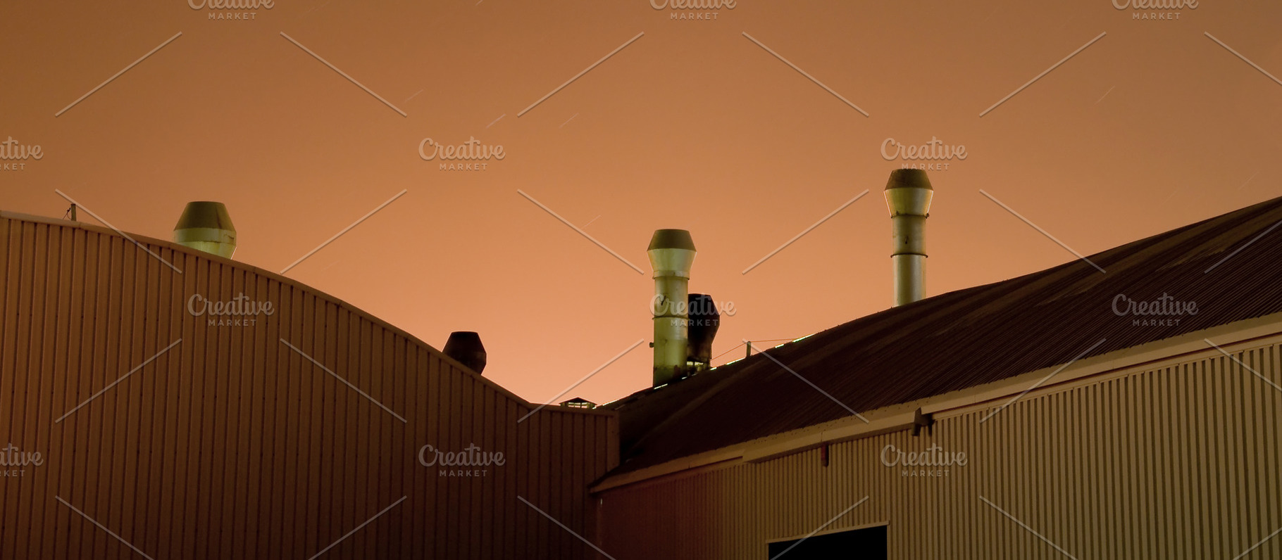 Industrial Roof Vents Against Orange Night Sky, an Industrial Photo by Davizro's Market