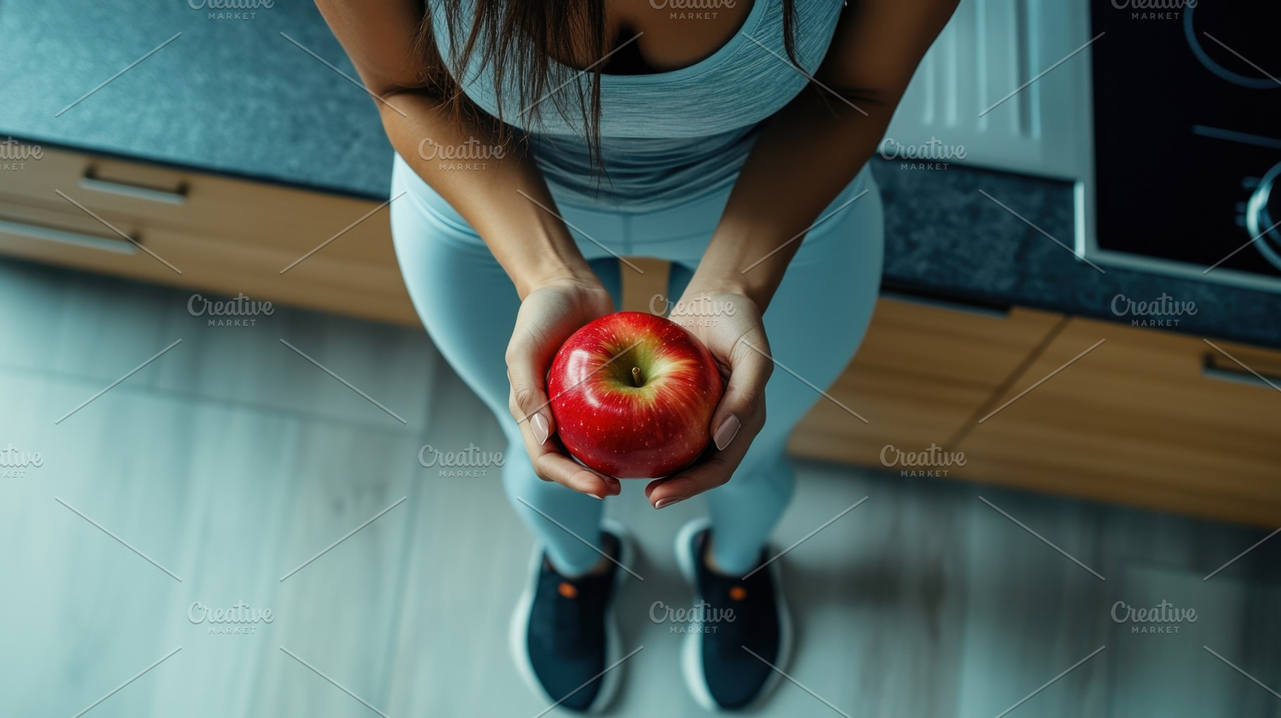 Holding a red apple in the kitchen, a Photo by Beautiful things